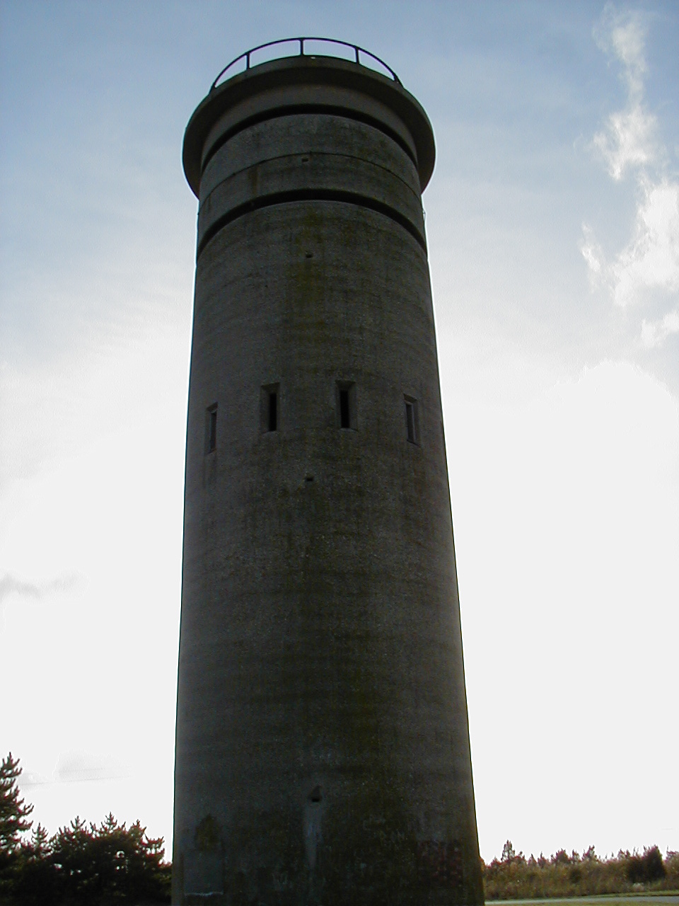 Full tower against washed sky