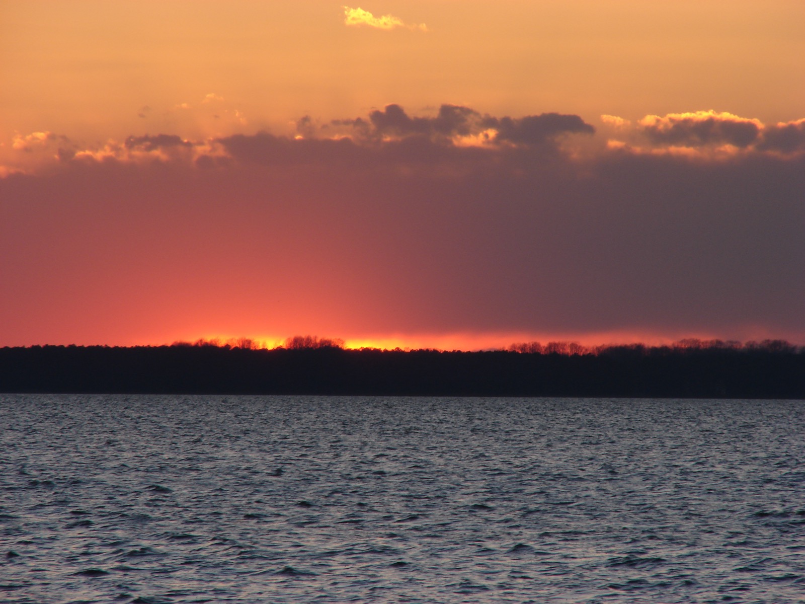Dramatic dawn / dusk over water